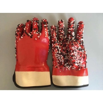 Red pvc gloves with chips on the palm